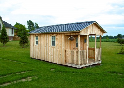 Amish Shed with porch and green roof